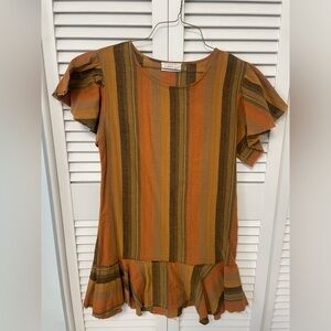 Adorable dress with ruffles on these sleeves and hem.